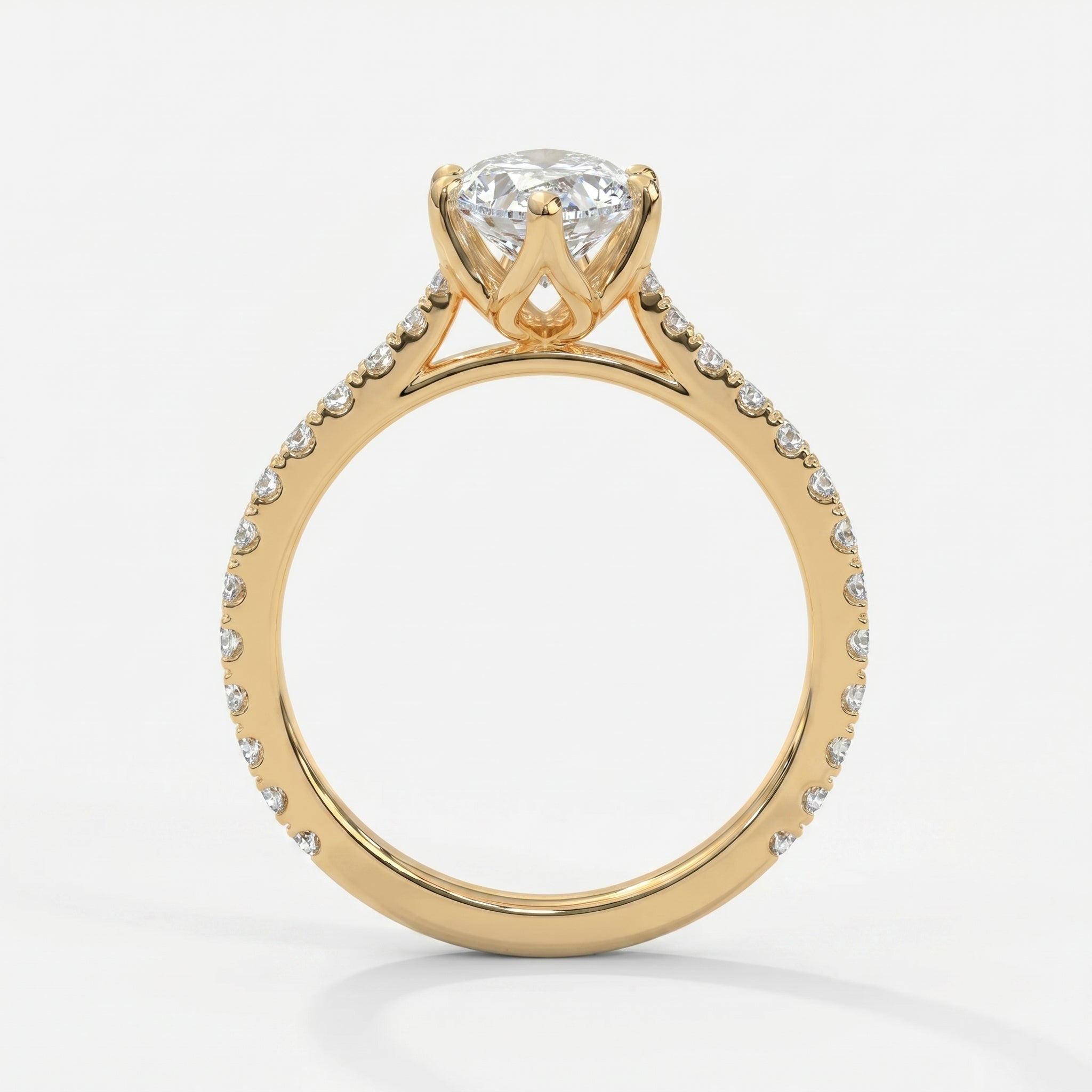 Side profile of marquise diamond engagement ring featuring cathedral setting and pavé diamond shoulders.