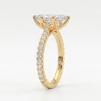 Luxury marquise diamond engagement ring in yellow gold shown at 45-degree angle highlighting brilliance and pavé band.