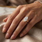 Marquise-cut solitaire diamond engagement ring in yellow gold with elegant six-prong setting and brilliant sparkle.