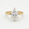 Front view of marquise cut diamond engagement ring featuring six-prong yellow gold solitaire setting