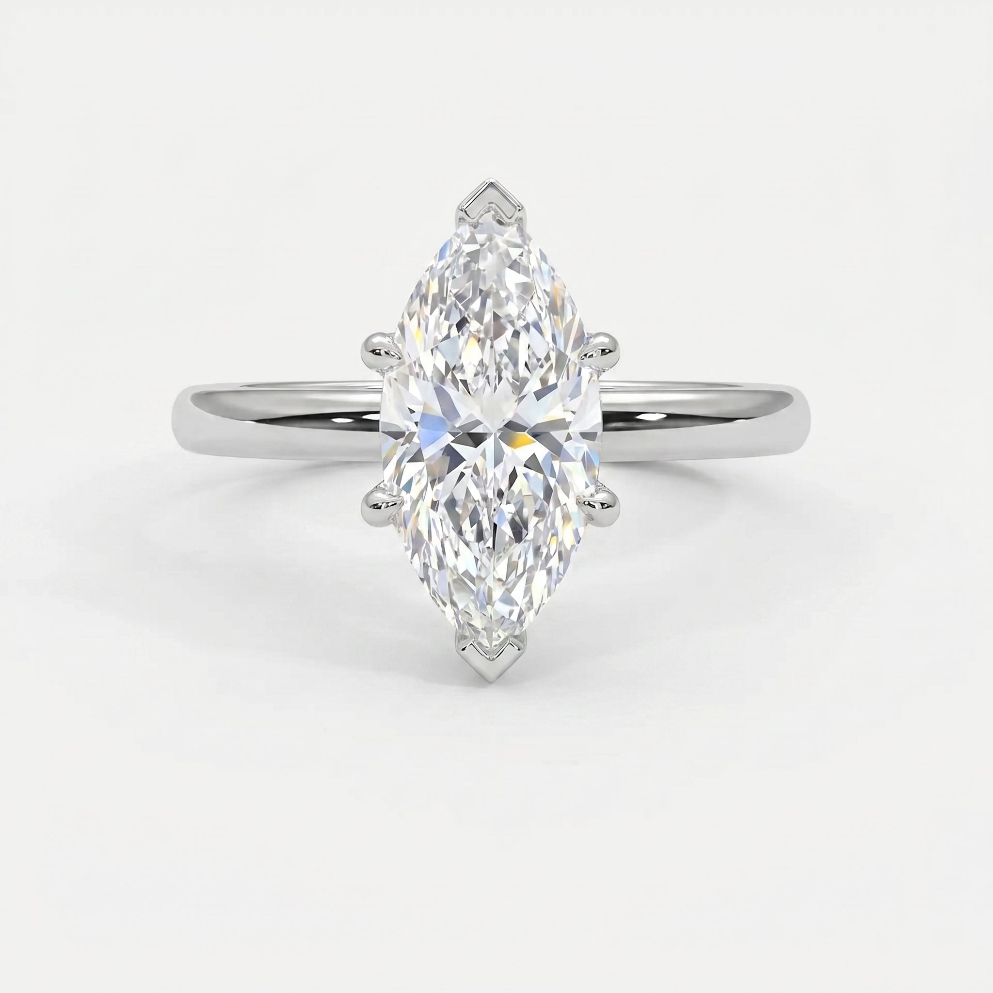 Elegant marquise diamond engagement ring featuring a white gold solitaire setting and brilliant faceted center stone.
