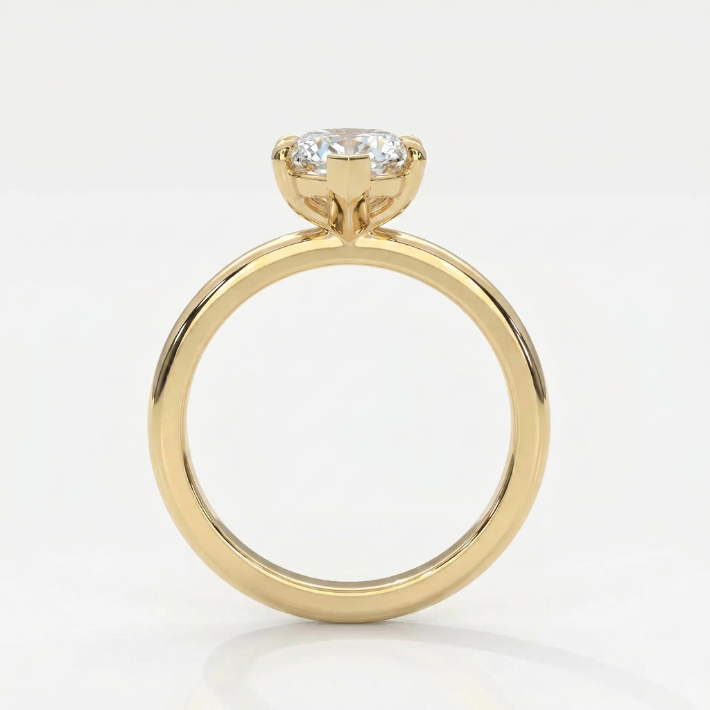 Side profile of marquise diamond engagement ring showing elevated cathedral setting and yellow gold band.