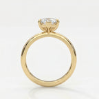 Side profile of marquise diamond engagement ring showing elevated cathedral setting and yellow gold band.
