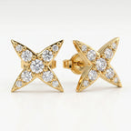 Minimalist flat lay of diamond star stud earrings on white background with elegant luxury jewelry styling