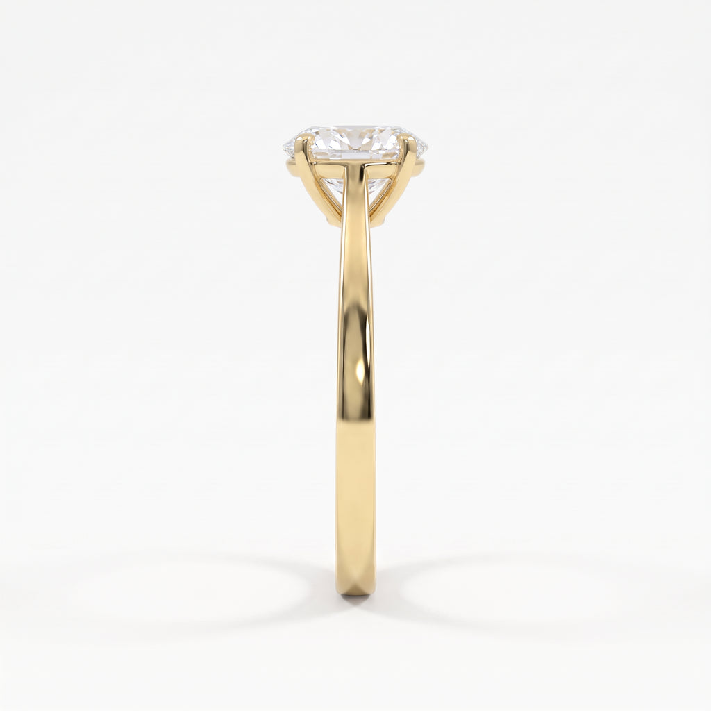 Side profile of a polished yellow gold oval diamond solitaire ring showcasing its elevated basket setting and refined cathedral-style shoulders.