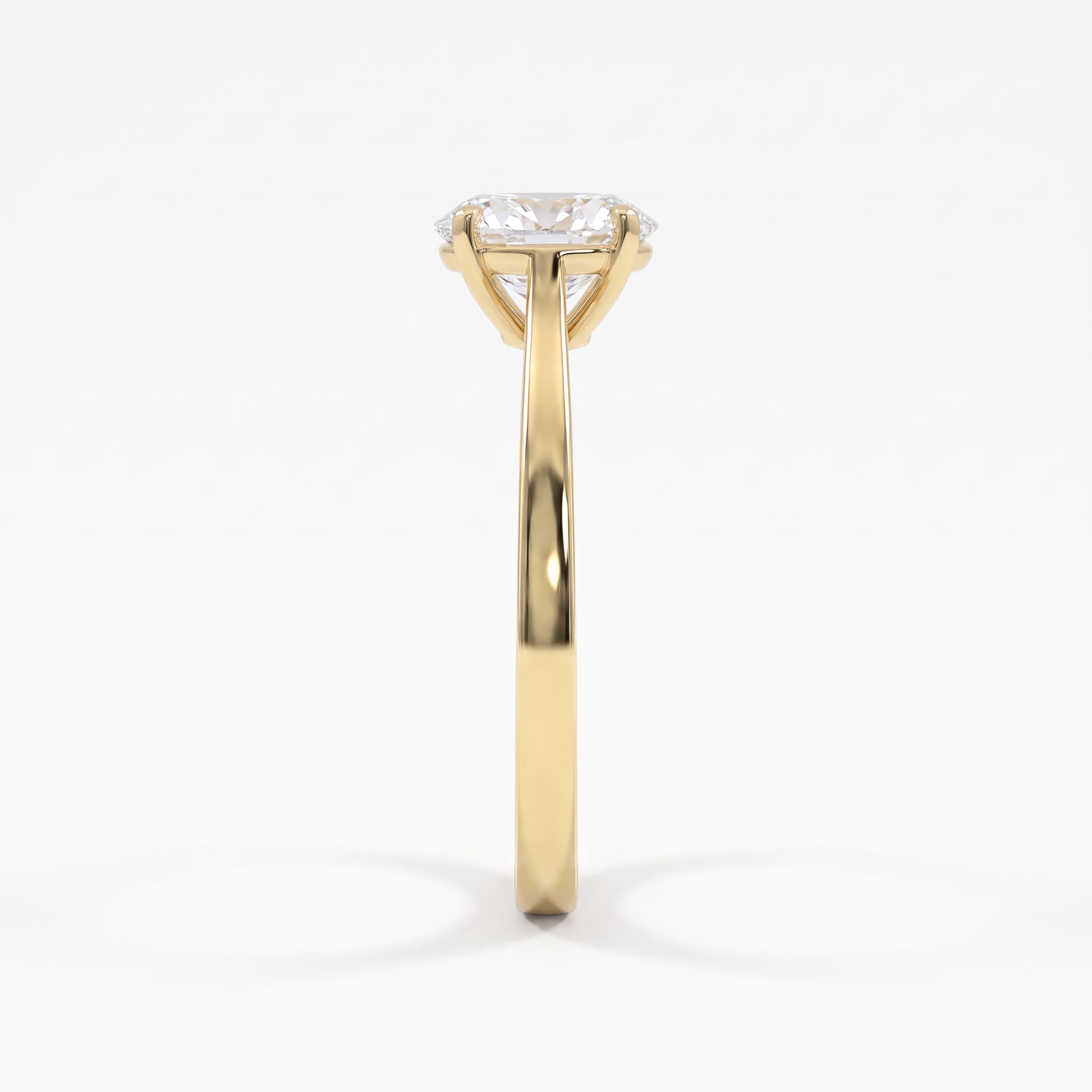 Side profile of a polished yellow gold oval diamond solitaire ring showcasing its elevated basket setting and refined cathedral-style shoulders.