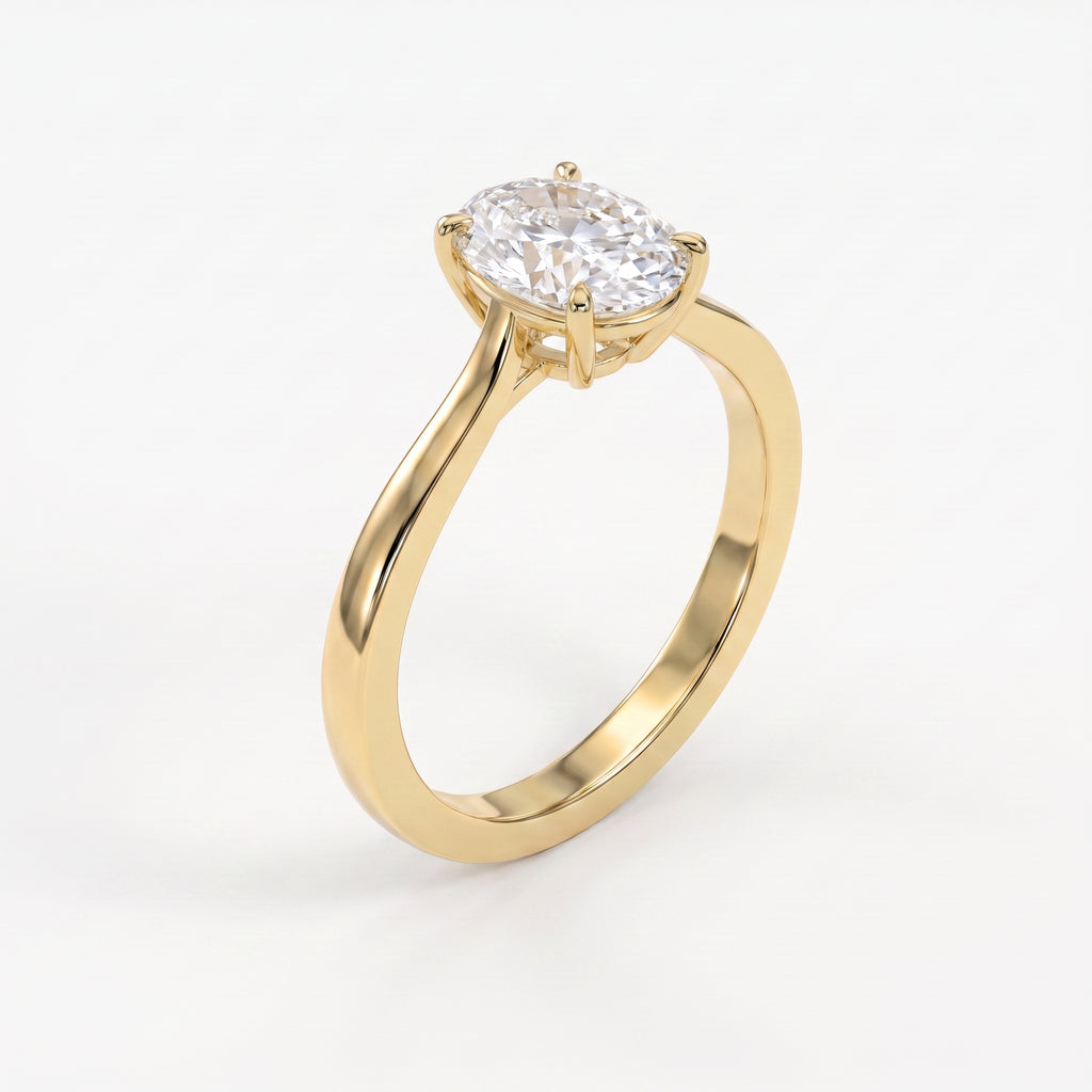 45-degree view of an oval solitaire diamond ring in yellow gold highlighting the elegant four-prong setting.