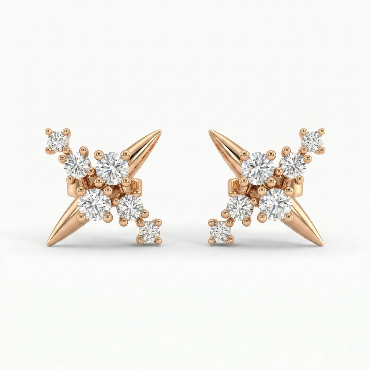 Rose gold diamond starburst stud earrings with clustered round diamonds and modern spike design on white background