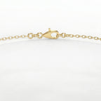 Close-up of round brilliant solitaire stone on delicate yellow gold bracelet with luxury finish