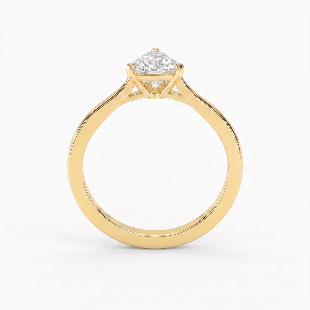 Minimalist traingle cut diamond solitaire engagement ring in polished yellow gold with elegant three-prong setting.