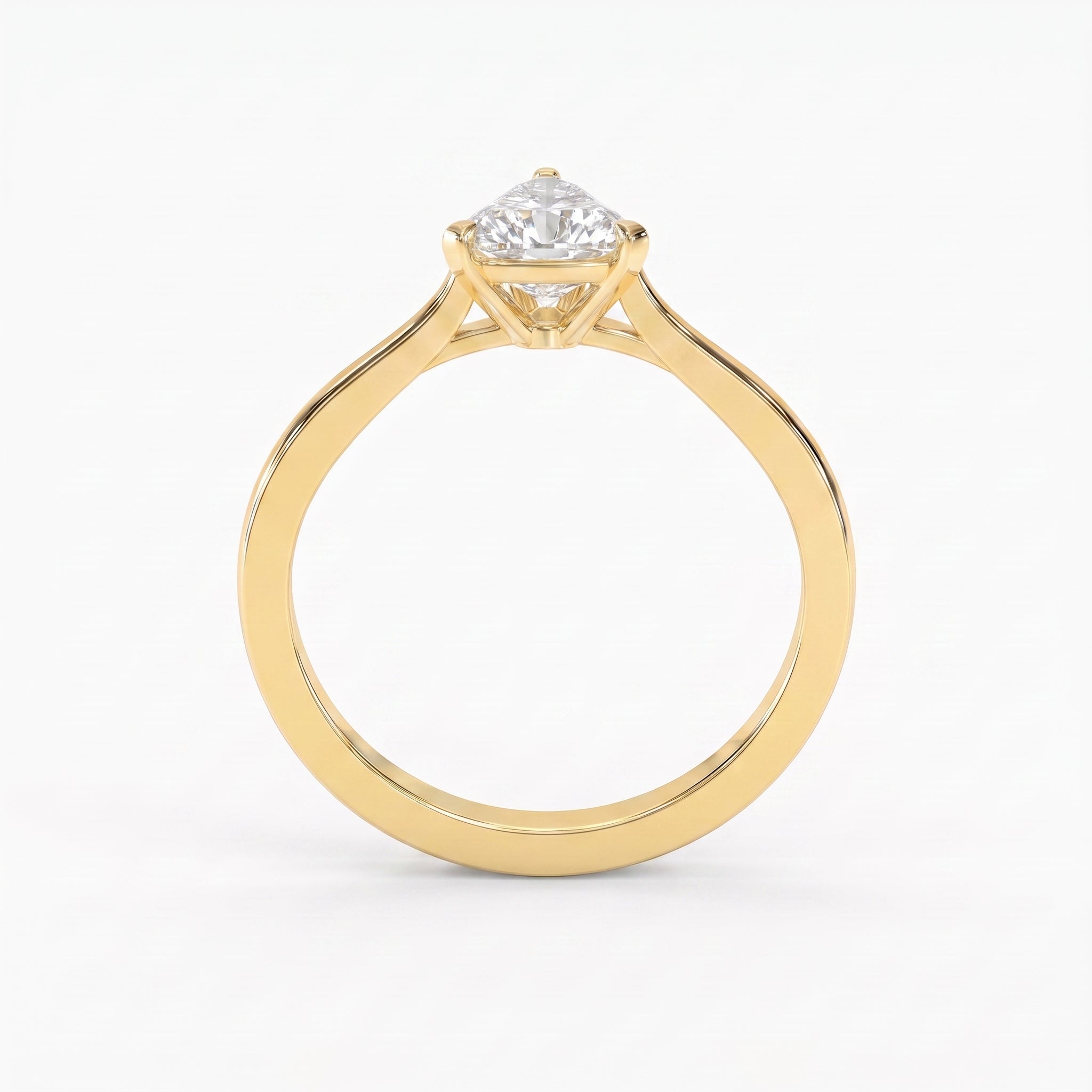 Minimalist traingle cut diamond solitaire engagement ring in polished yellow gold with elegant three-prong setting.