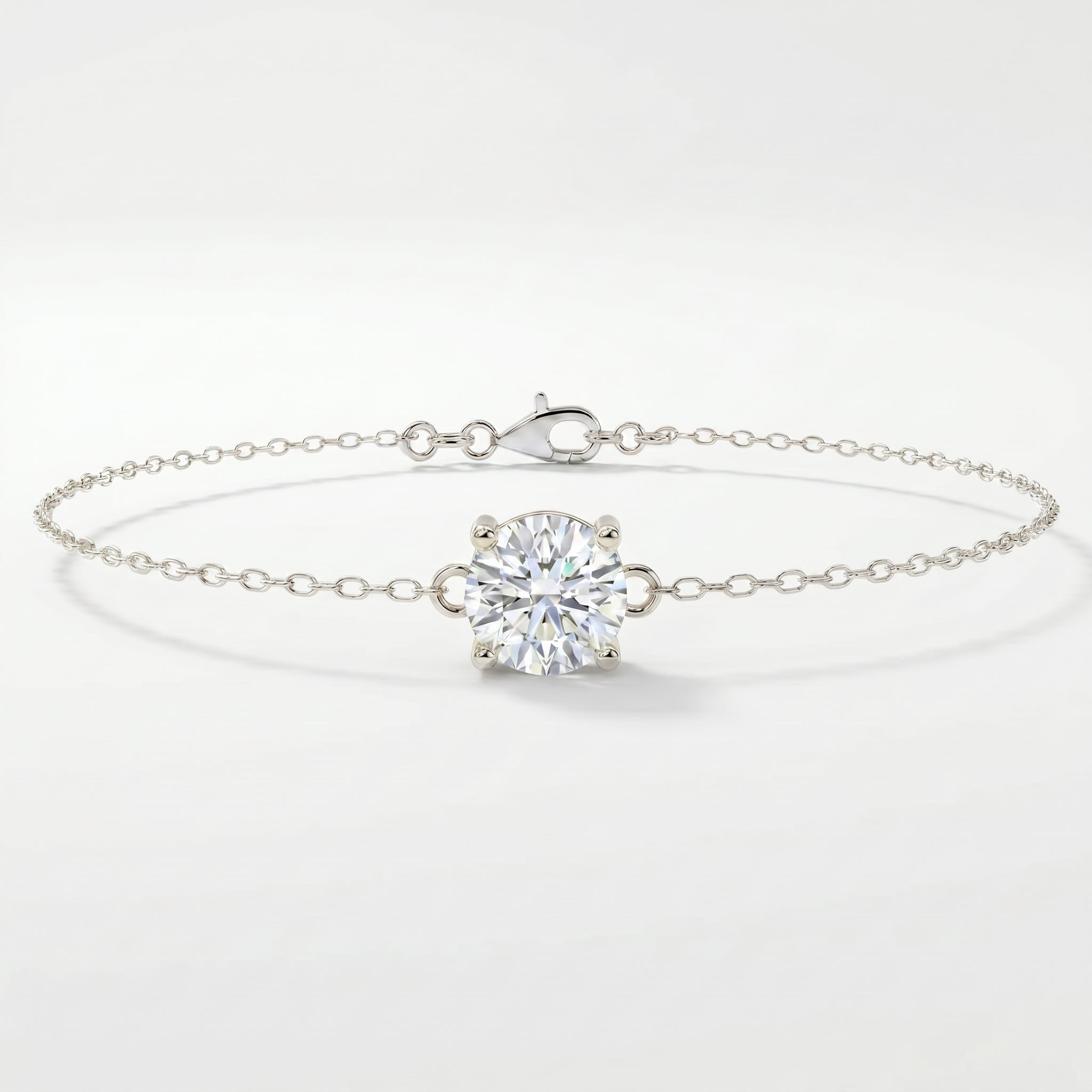 White gold solitaire bracelet with brilliant round gemstone on delicate chain