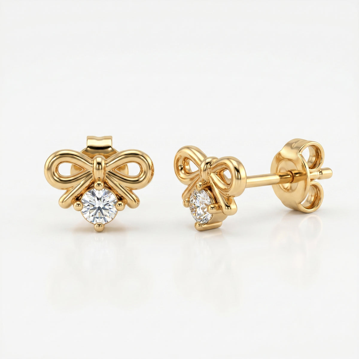 Woman wearing minimalist yellow gold bow earrings with sparkling crystal in elegant everyday styling