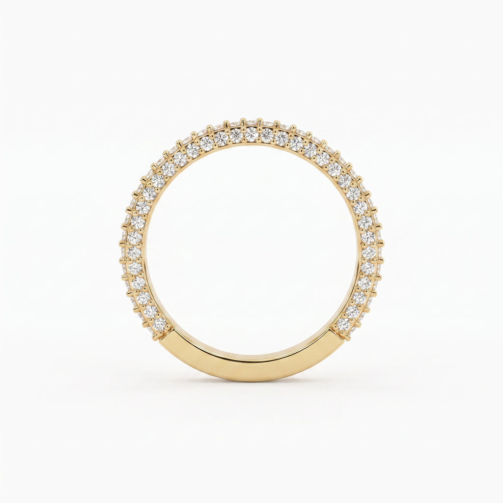 Front view of a yellow gold diamond eternity band featuring brilliant round diamonds in a premium shared prong setting.