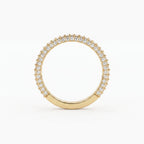 Front view of a yellow gold diamond eternity band featuring brilliant round diamonds in a premium shared prong setting.
