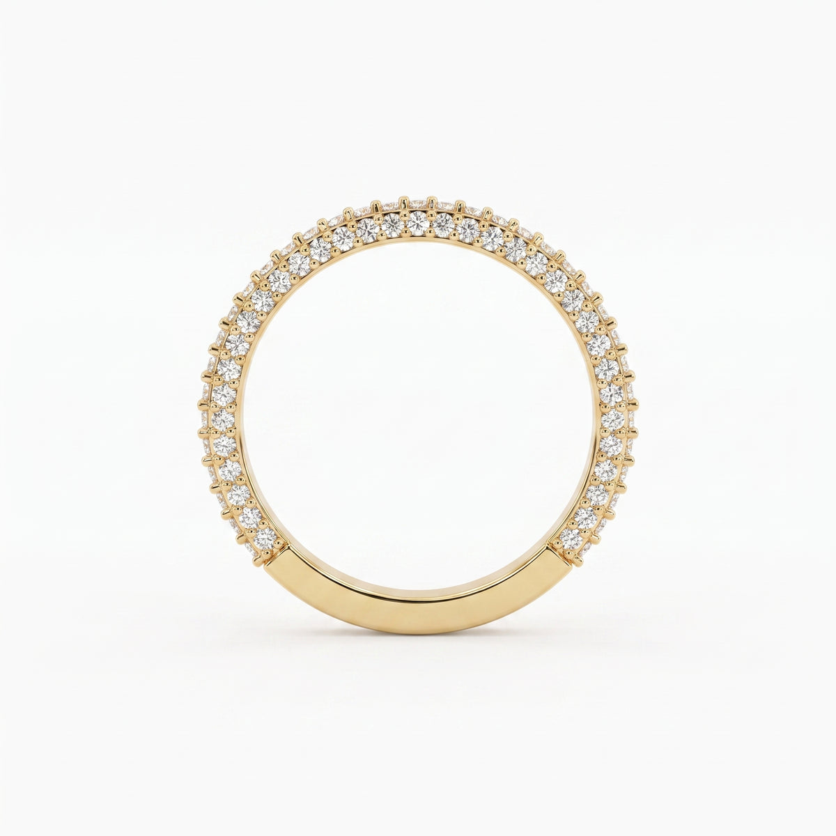 Front view of a yellow gold diamond eternity band featuring brilliant round diamonds in a premium shared prong setting.