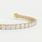 45-degree view of yellow gold diamond tennis bracelet highlighting sparkling stones and premium craftsmanship details.