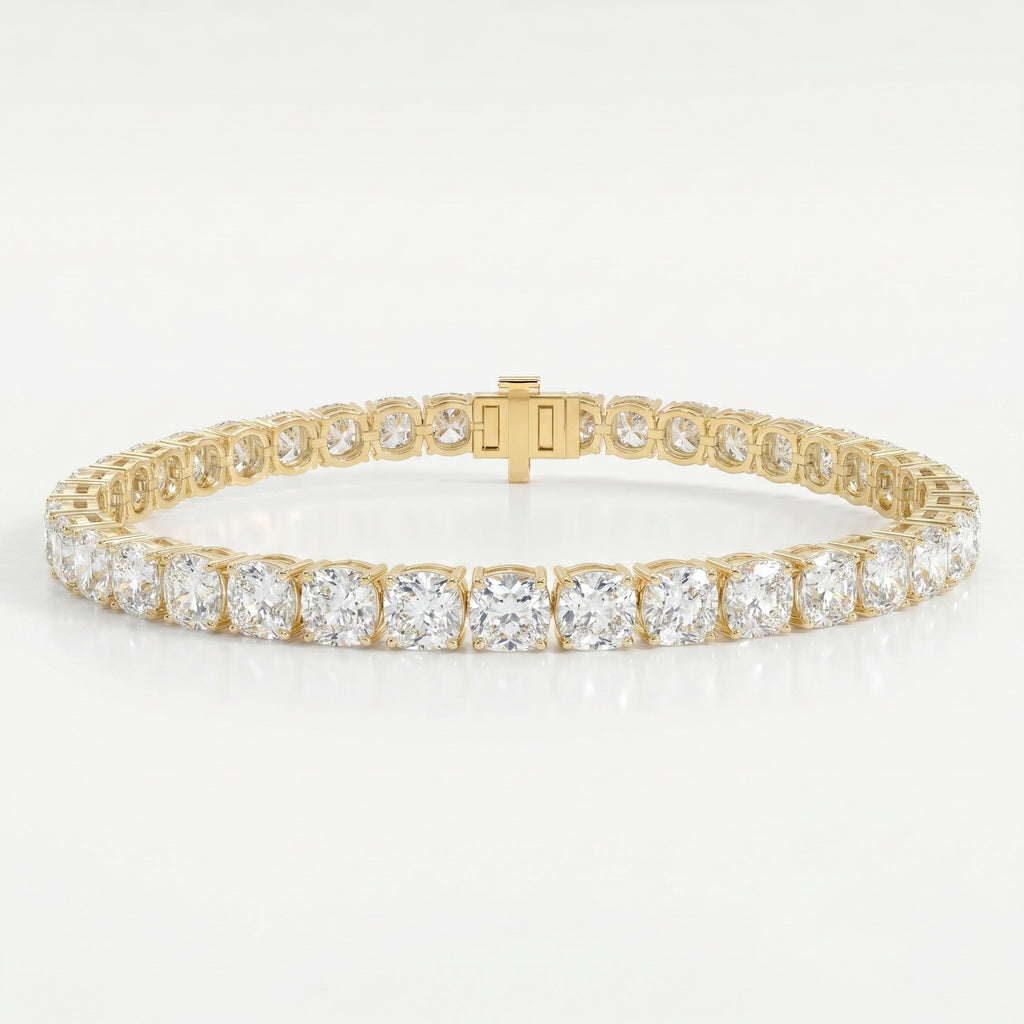 Luxury yellow gold tennis bracelet featuring brilliant Cushion-cut diamonds in a secure prong setting on white background.