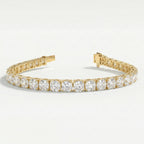 Yellow gold diamond tennis bracelet with open clasp showing secure locking mechanism and luxury jewelry construction.
