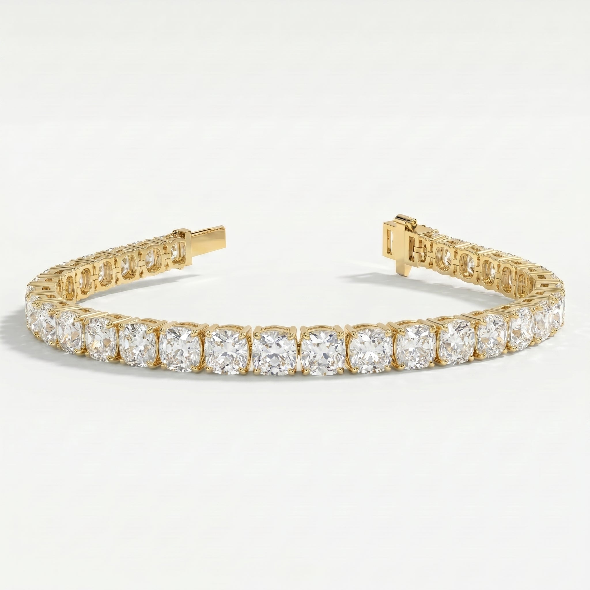 Yellow gold diamond tennis bracelet with open clasp showing secure locking mechanism and luxury jewelry construction.