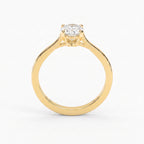 Front view of a yellow gold oval diamond solitaire engagement ring featuring a secure four-prong setting and elegant minimalist band.