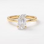 Flame-cut diamond solitaire engagement ring in polished yellow gold with four-prong setting on a clean white background.