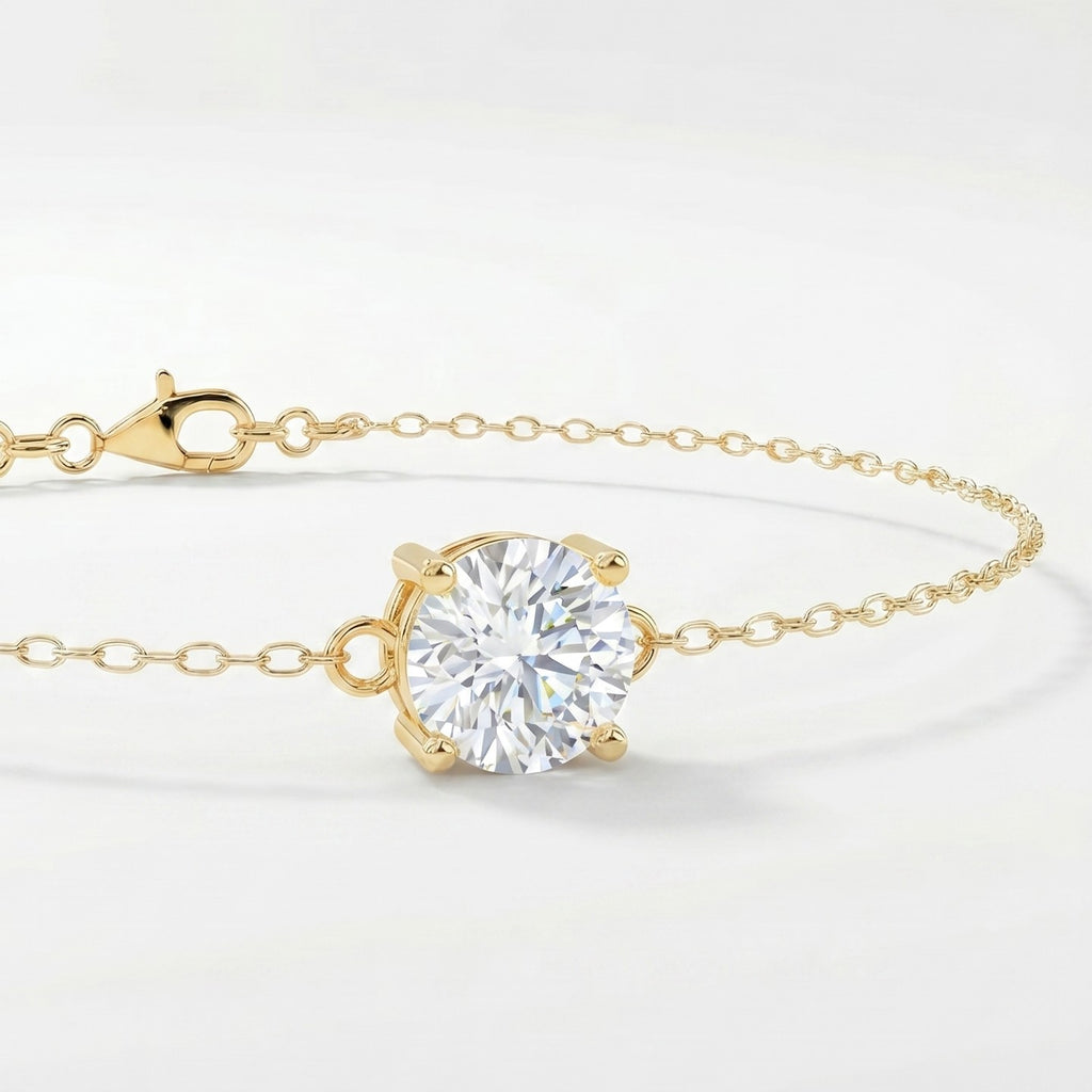 Dainty yellow gold chain bracelet with sparkling round solitaire gemstone in four-prong setting