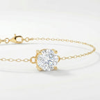 Dainty yellow gold chain bracelet with sparkling round solitaire gemstone in four-prong setting